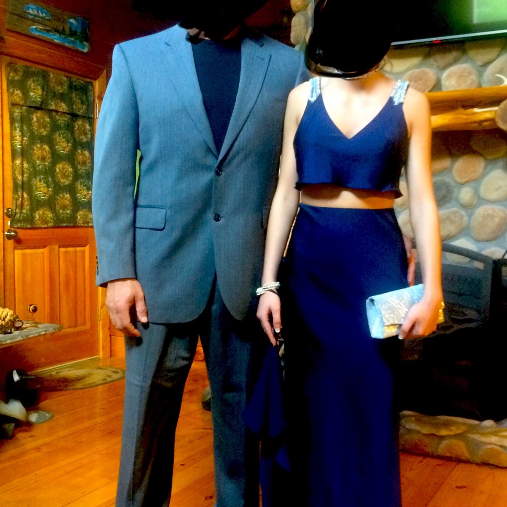 Beautiful formal dress. Worn 4for about 4hours. Navy blue with gorgeous details.